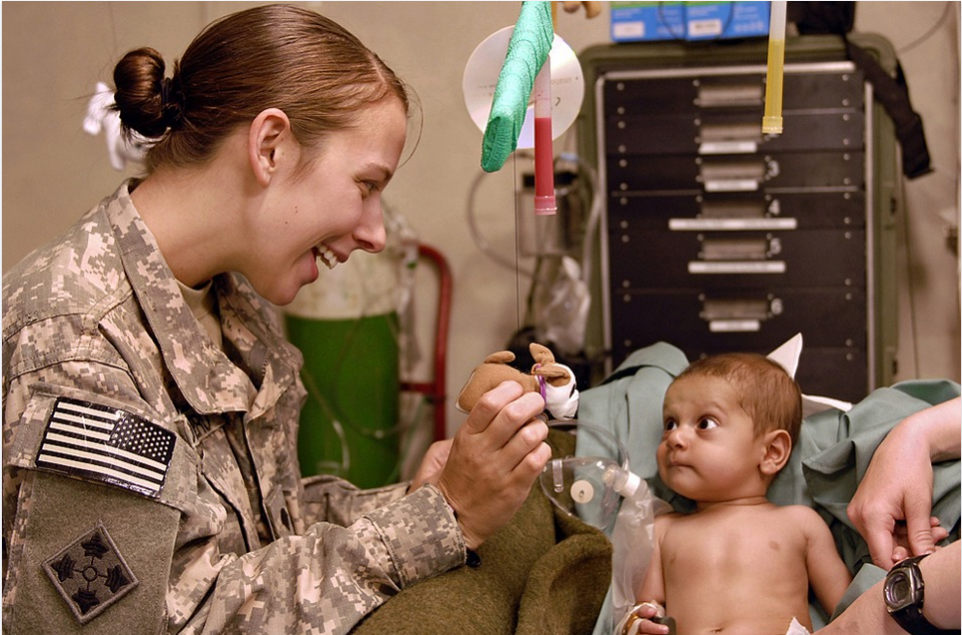 soldier playing with a child